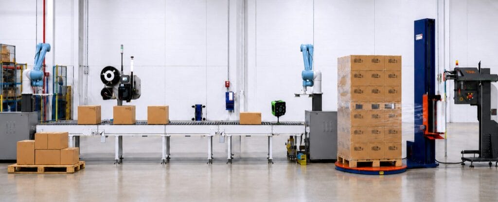 An image of a warehouse setting with a production line showing automtion equipment like a labeller, palletiser and stretch wrapper